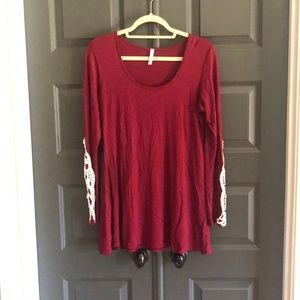 Burgundy tunic top with lace detail on sleeves